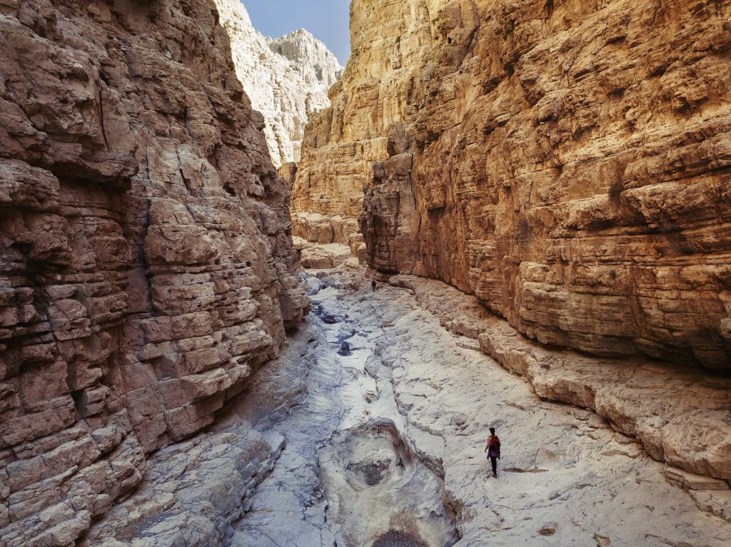 woman walking in the gorge in ras alkhaimah uae