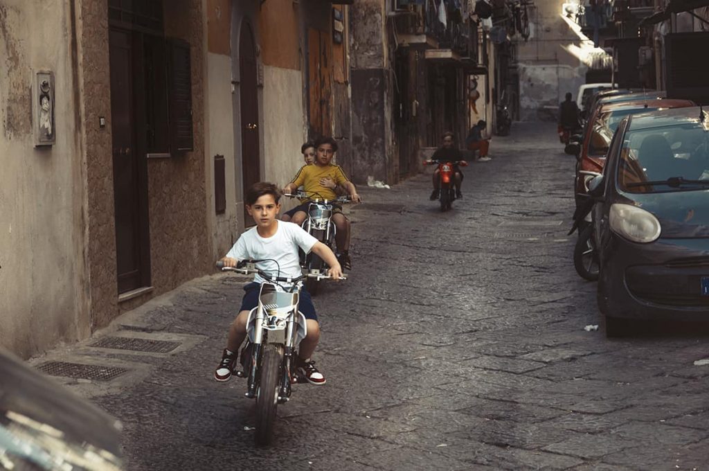 young kids driving scooters in italy- sicily driving tips