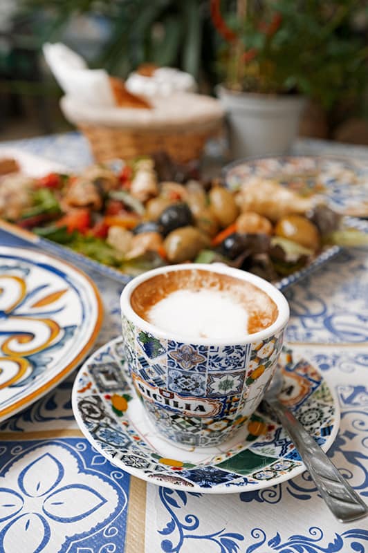 colorful cup of espresso machiato in sicily