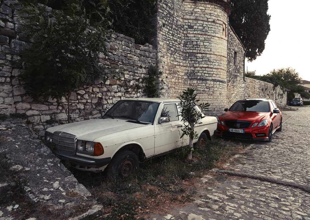 Driving in Albania and renting a car in Albania, Tirana tips-Berat two Mercedes- old and new parked