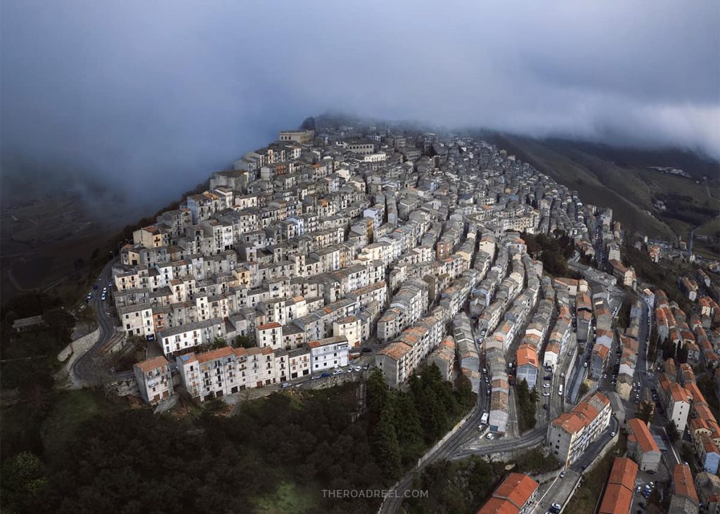 A Guide to Visiting Gangi Mountain Town in Sicily. Best things to do in Gangi, aerial photo of Gangi in fog