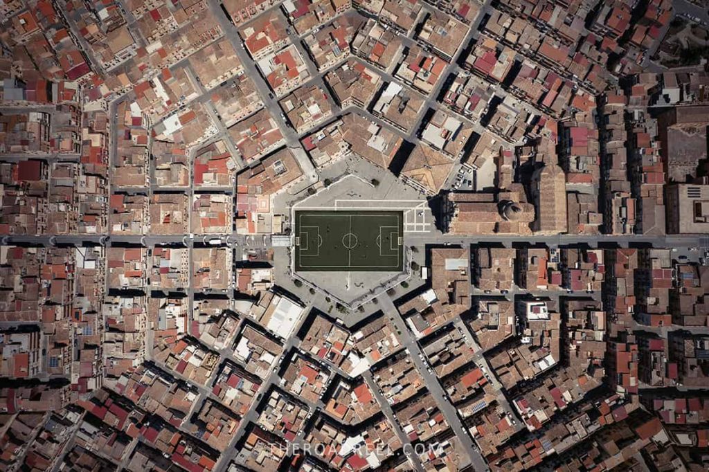 Grammichele hexagon town in Sicily with football field in the middle, drone shot