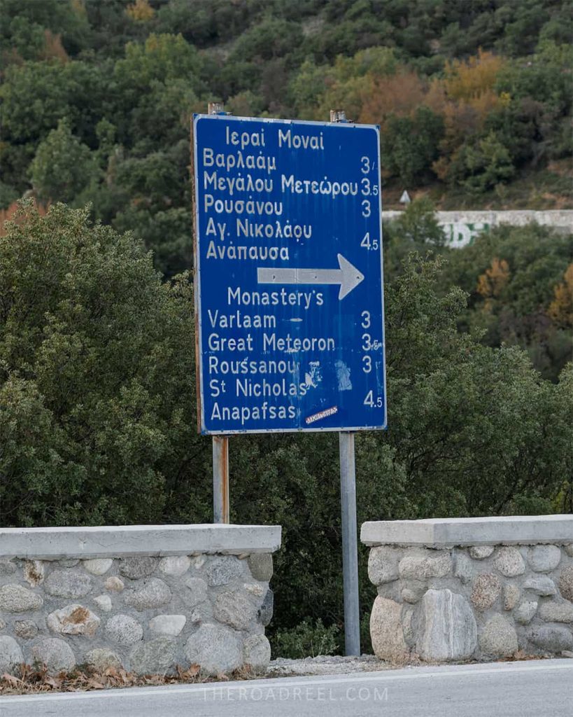road sign showing distances between monasteries
