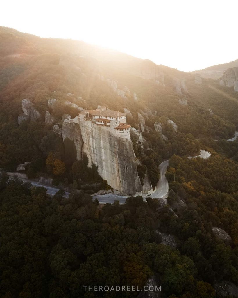 Drone capture of Roussanou monastery at sunrise.