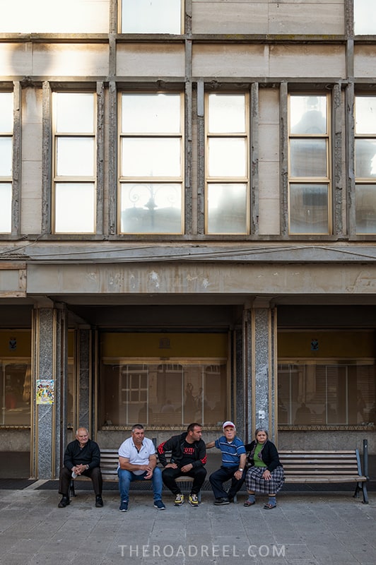 Ragusa Superiore, Sicily, people sitting on the bench