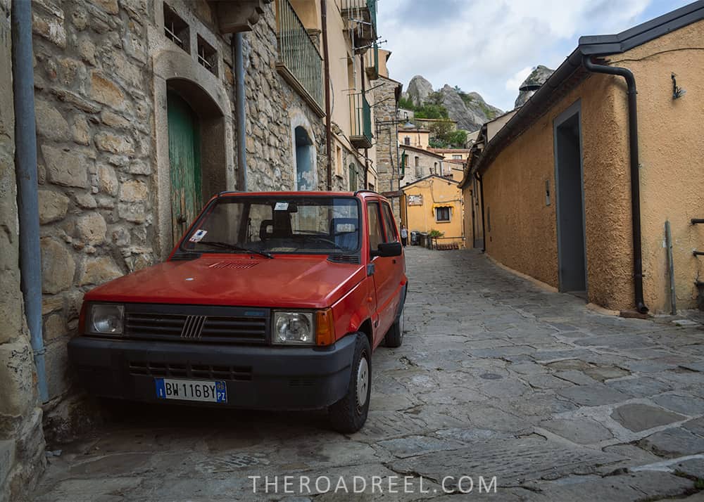 Old school red Fiat car in Castelmezzano, Basilicata, Italy