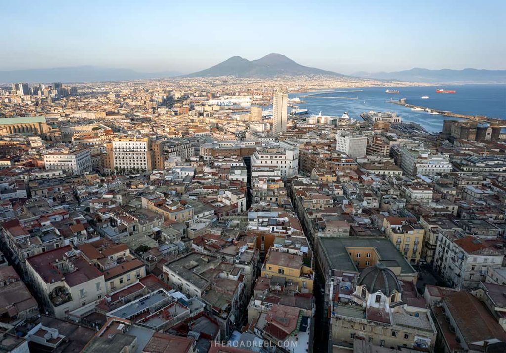 Enjoying sunset views over Naples Bay is one of the best things to do in Naples in one day, naples drone photo with Vesuvius 