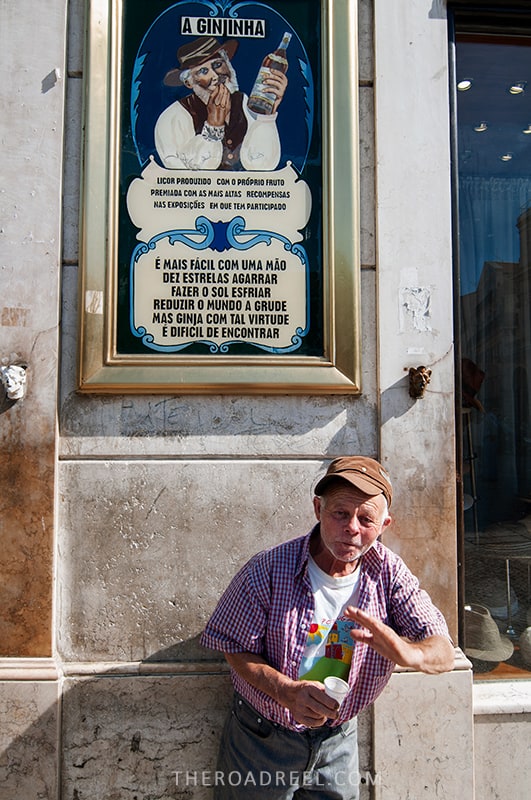 A Ginjinha- famous old liquor store in Lisbon, a drunk man standing next to the liquor store