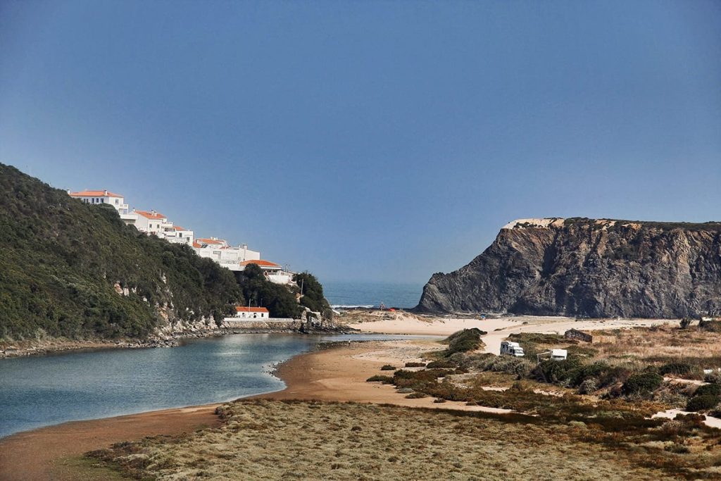 Ribeira de Seixe forming a quiet lagoon in Praia de Odeceixe, a view from the river side towards the beach