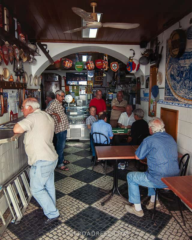 Coffee shop-bar in Alfama, Lisbon, with a group of old men hanging out