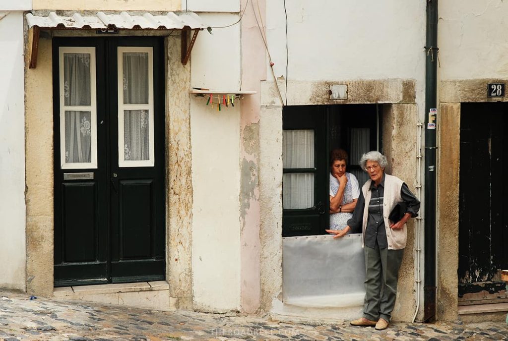 Ladies in Alfama streets, Lisbon, one day lisbon itinerary