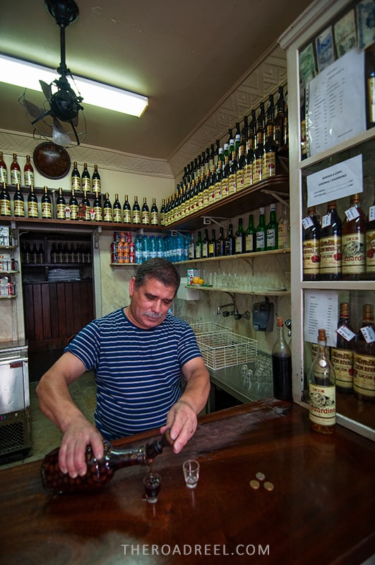 Ginjinha Sem Rival- one of the oldest shops in Lisbon, man puring cherry liquor