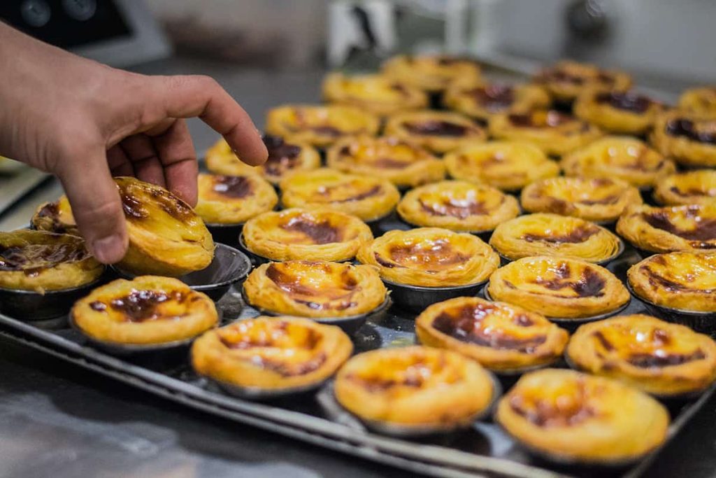 A must try pastry in Lisbon- pastéis de nata (or pastel de nata)- a tray full of pasteis  de nata