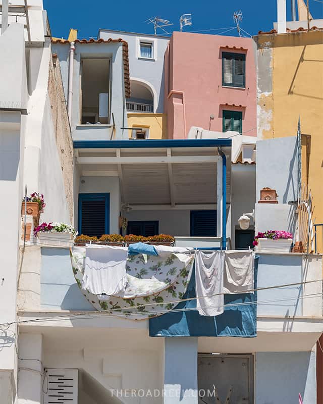 balcony and colorful houses in marina di corricella fishing villages