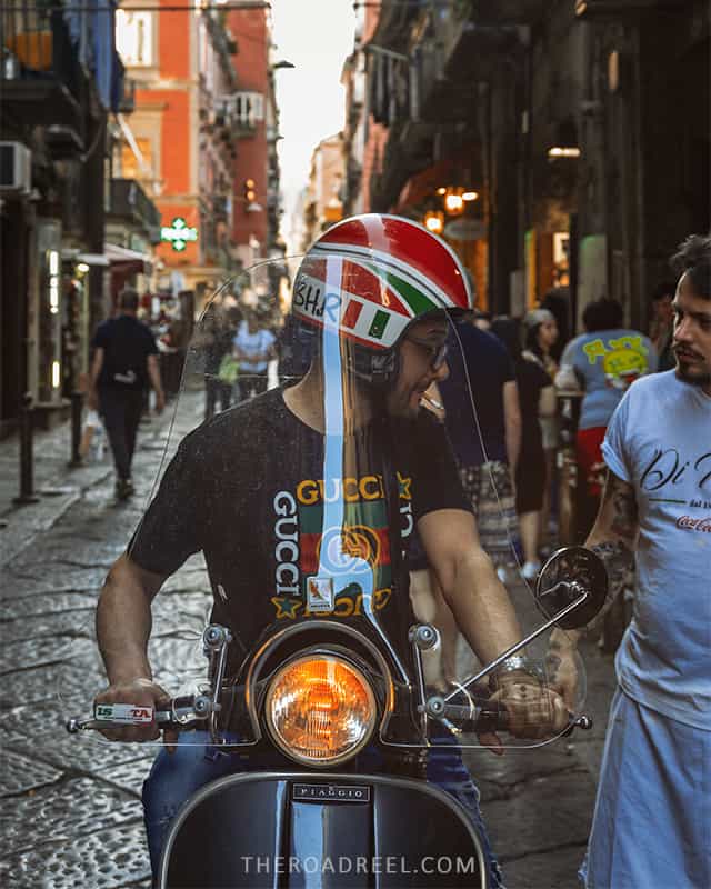Driving in Naples and South Italy guide, a man in Gucci t-shirt in via dei Tribunali, Naples