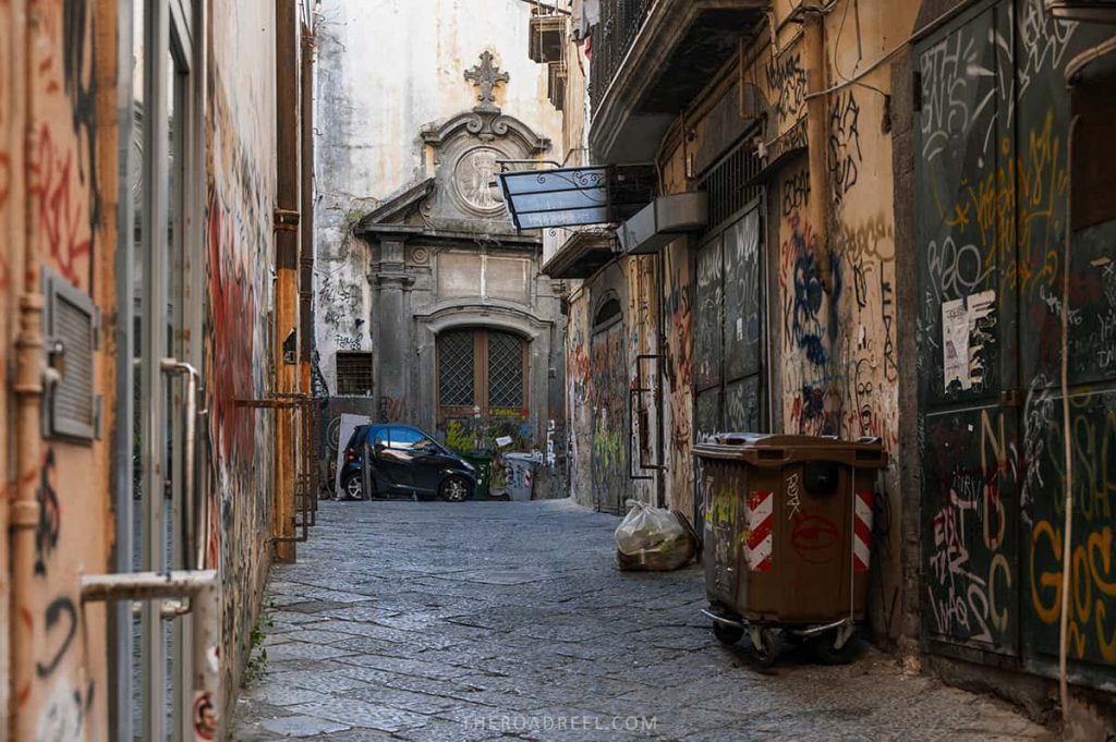 driving in Naples and South Italy tips, a Smart car parked in a narrow street in naples