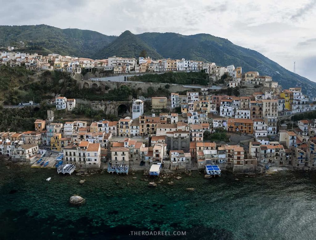 The best things to do in Scilla & Chianalea: Seaside Towns in Calabria, Italy, calabria itinerary, drone image of scilla and chianalea on a cloudy day