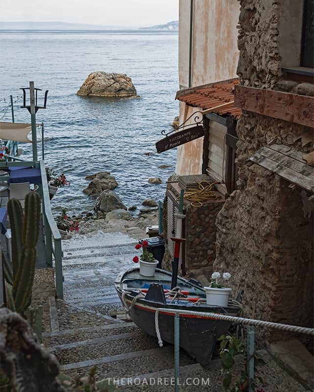 The best things to do in Scilla & Chianalea- gozzo boat parked in a tiny alleyway