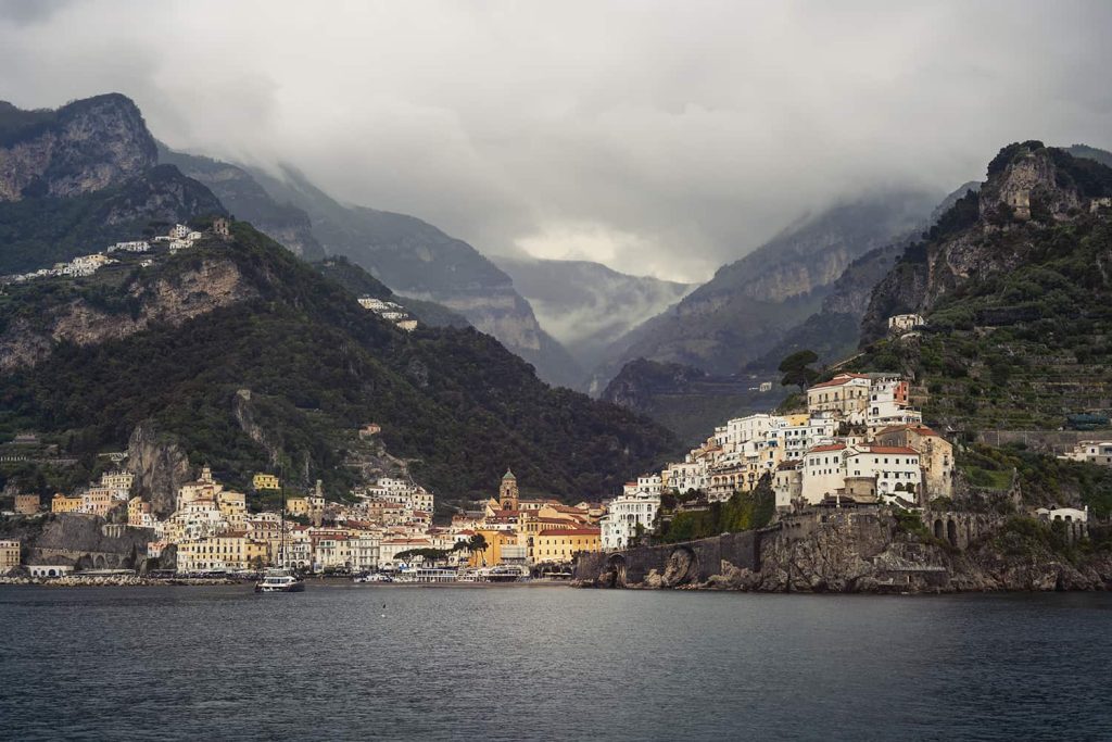 Naples to Calabria road trip in South Italy-Amalfi coast from the boat on a cloudy evening