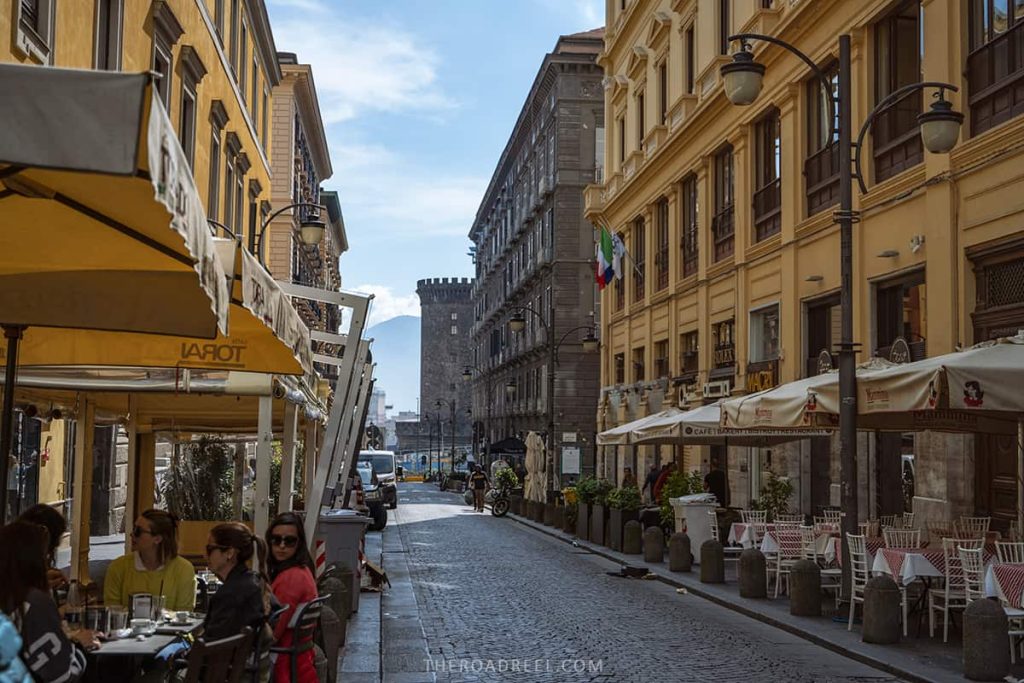 one day in naples itinerary- castel nuovo tower from one of the streets in porto di napoli