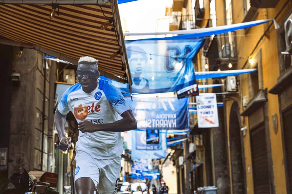 Victor Osimhen- a famous football player in Napoli Football Club is one of the most featured people on the streets of Naples