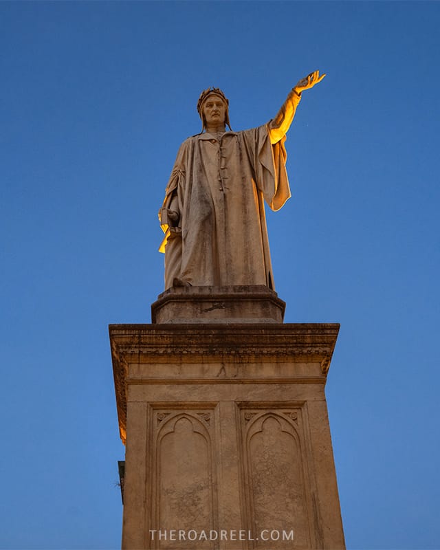 visiting naples:statue of Dante alighieri in piazza dante at dusk