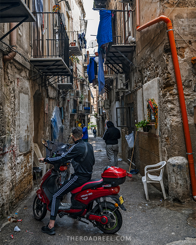 scotter in a tiny street in palermo- palermo driving tips