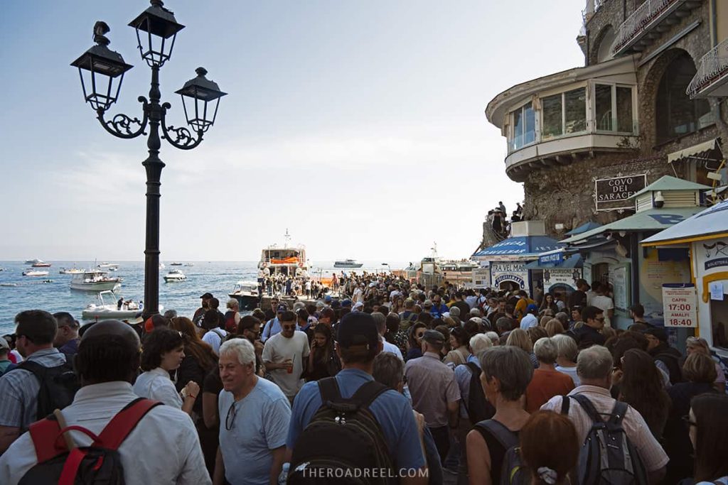 People queueing for a ferry in Positano, this image was taken in May (presumably a shoulder season)