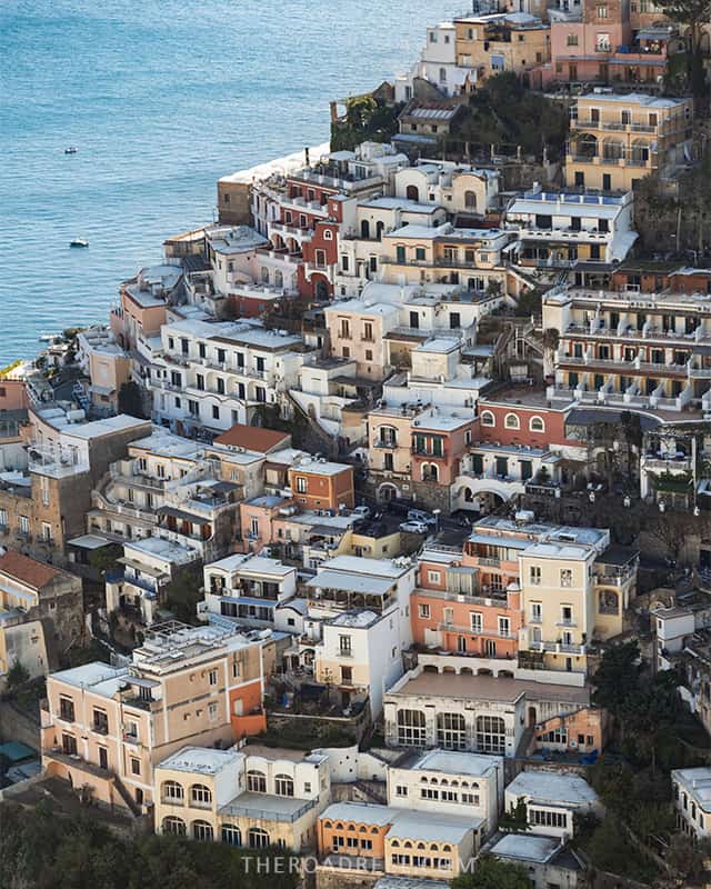 positano houses clinging down the cliff as seen from above